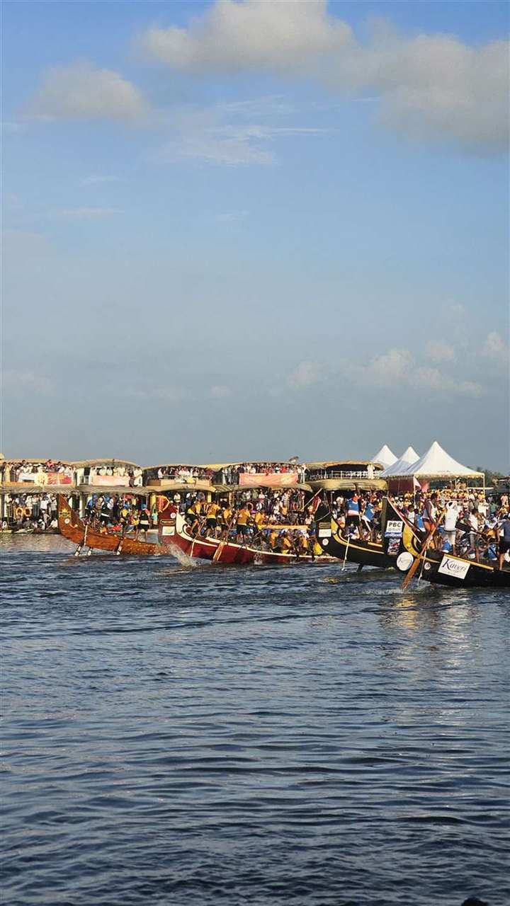 Snake boats lined up on the lake before a race in Alappuzha