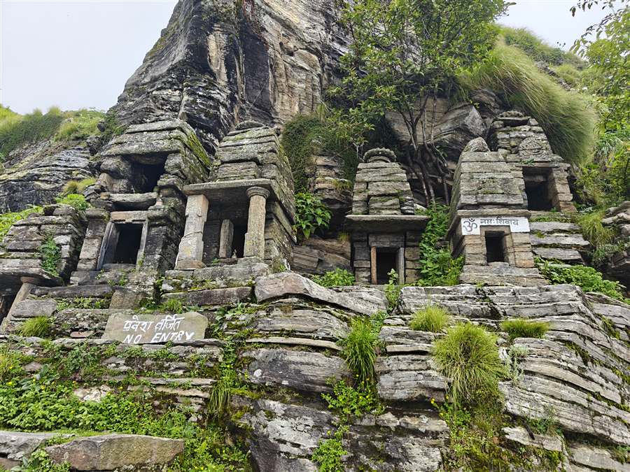 Ancient stone temples among rocks and trees