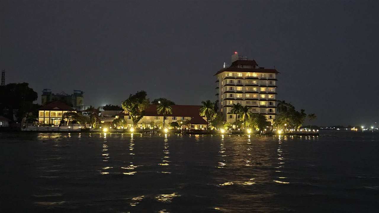 A lit-up lakeside hotel at night