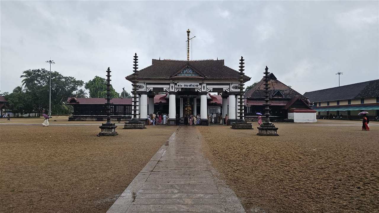 A Kerala temple and courtyard in the rain
